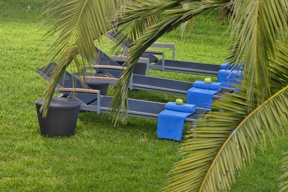 Sun loungers in the lawned garden for our guests' absolute comfort at the serviced apartments in Hersonissos Crete of Galaxy Villas